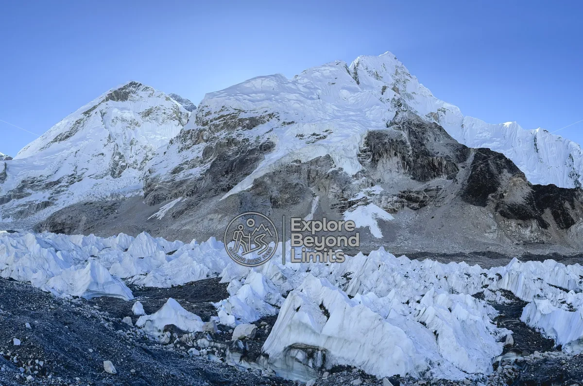 A trekker's-eye view of the Khumbu valley on the Everest Base Camp trail, prayer flags in the foreground