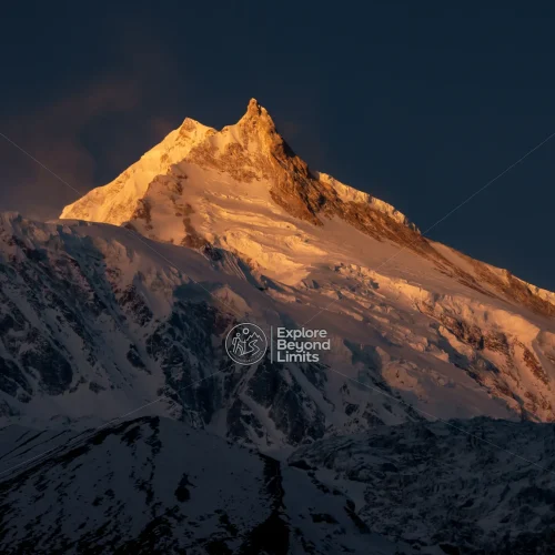 Mount Manaslu's summit above the Budhi Gandaki valley, seen from near Samagaun village