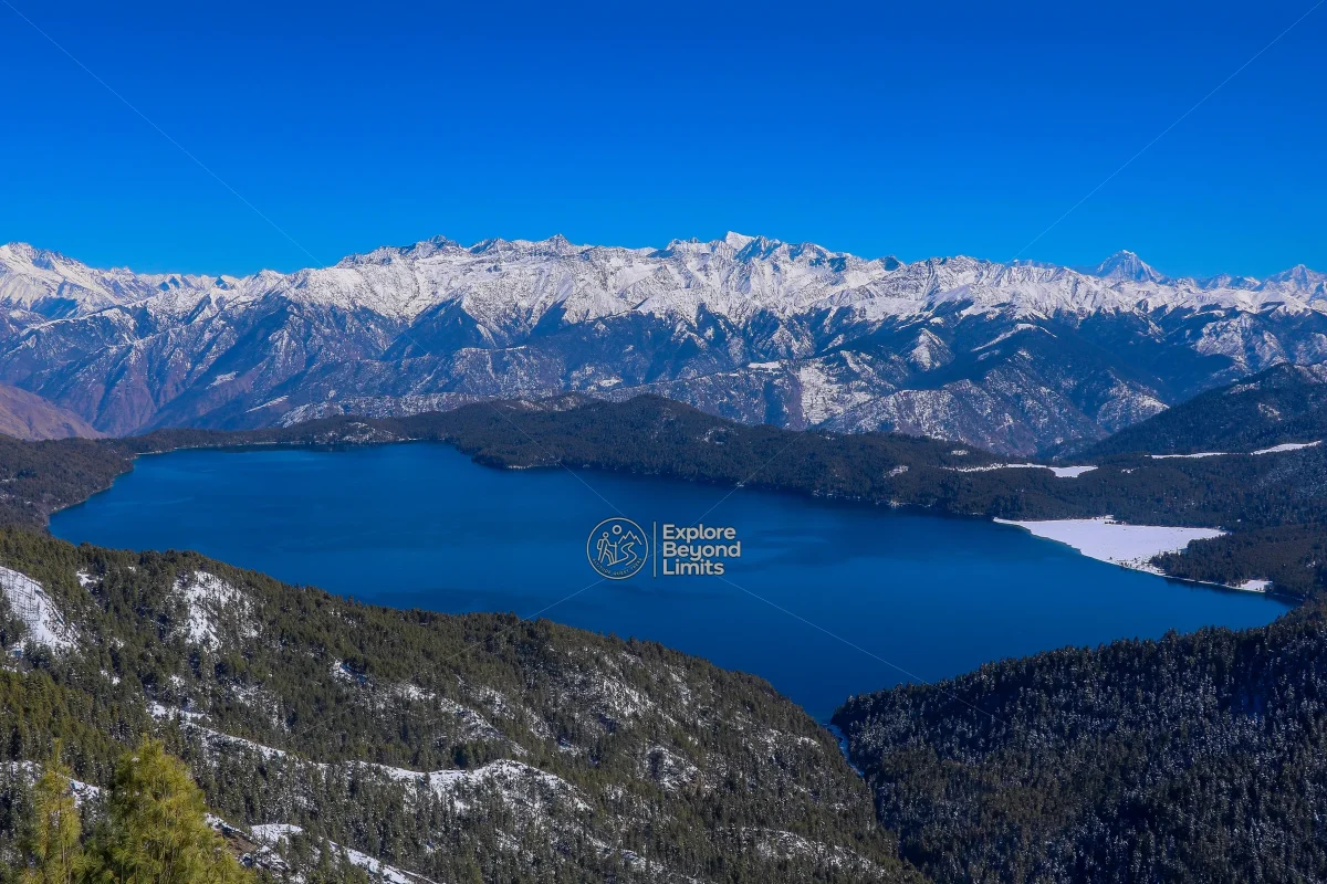 Rara Lake seen from Murma Top, its blue water ringed by pine forest in Nepal's far west
