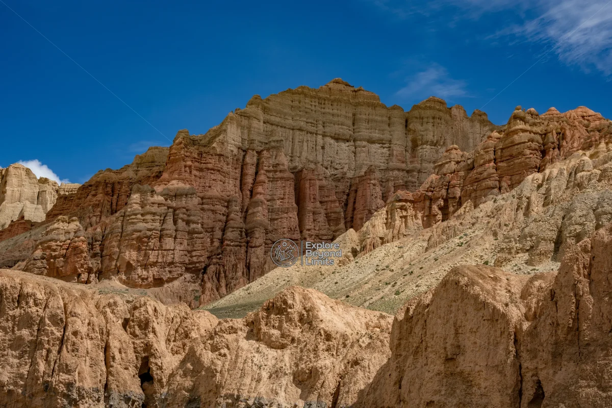 Wind-carved cliffs and the arid high-desert landscape of Upper Mustang, on the road toward Lo Manthang