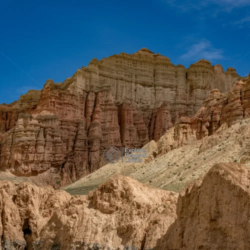 Wind-carved cliffs and the arid high-desert landscape of Upper Mustang, on the road toward Lo Manthang